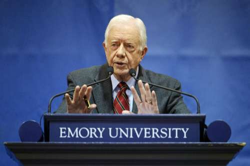 美国前总统卡特挺奥巴马医保政策掀种族风波(