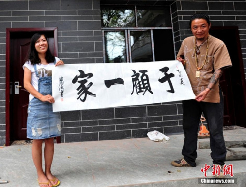 “辞职看世界”女教师因爱情定居成都开客栈。 安源 摄 “辞职看世界”女教师因爱情定居成都开客栈。 安源 摄