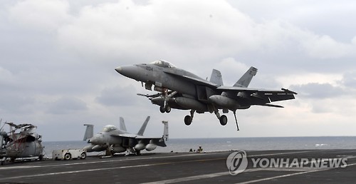 3��14�գ�F/A-18ս�����ڡ���������ɭ���ź˶�����ĸ�Ͻ��䡣��ͼƬ��Դ�������磩