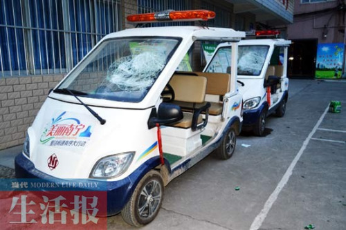 摊贩占道经营被城管暂扣煤气罐酒后砸车泄愤被拘(图)