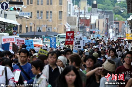 日本安保法闯关参众两院安倍强行“掌舵”赴险滩