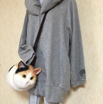 主妇设计超萌“猫咪手袋”外形逼真卖断货(图)