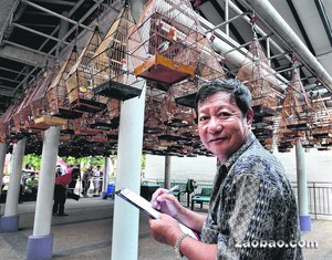 新加坡华人当“鸟评判”逾30年自身有绝活(图)