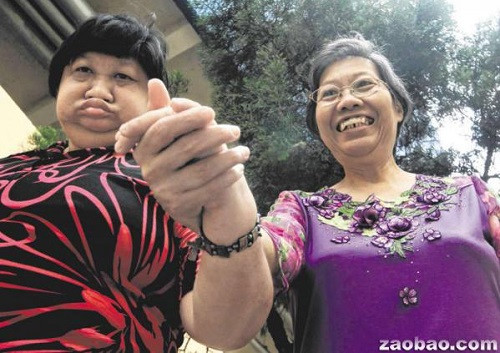 终生不嫁照顾智障妹妹新加坡华人妇女义举获表彰