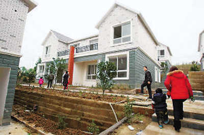 打工青年花1000万在家乡捐建15栋小洋楼送村民
