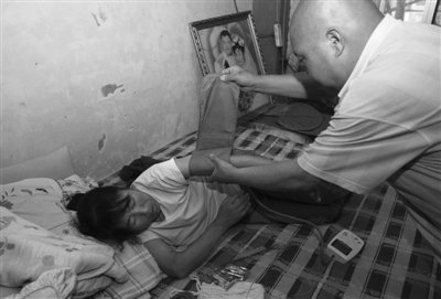 媒体评北京诈骗救妻悲剧:应给“穷人”更多保障