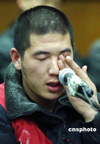 图杀害城管队长李志强的嫌犯北京法庭受审